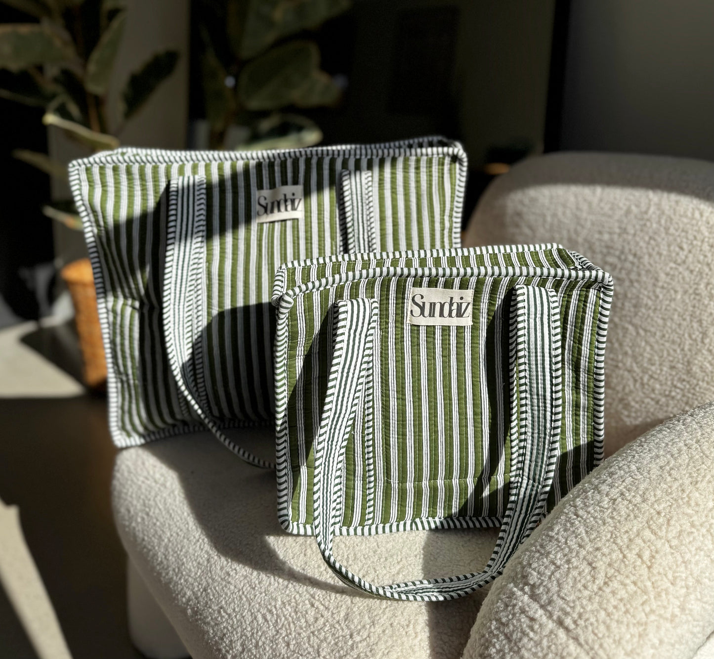 Olive stripe bags.