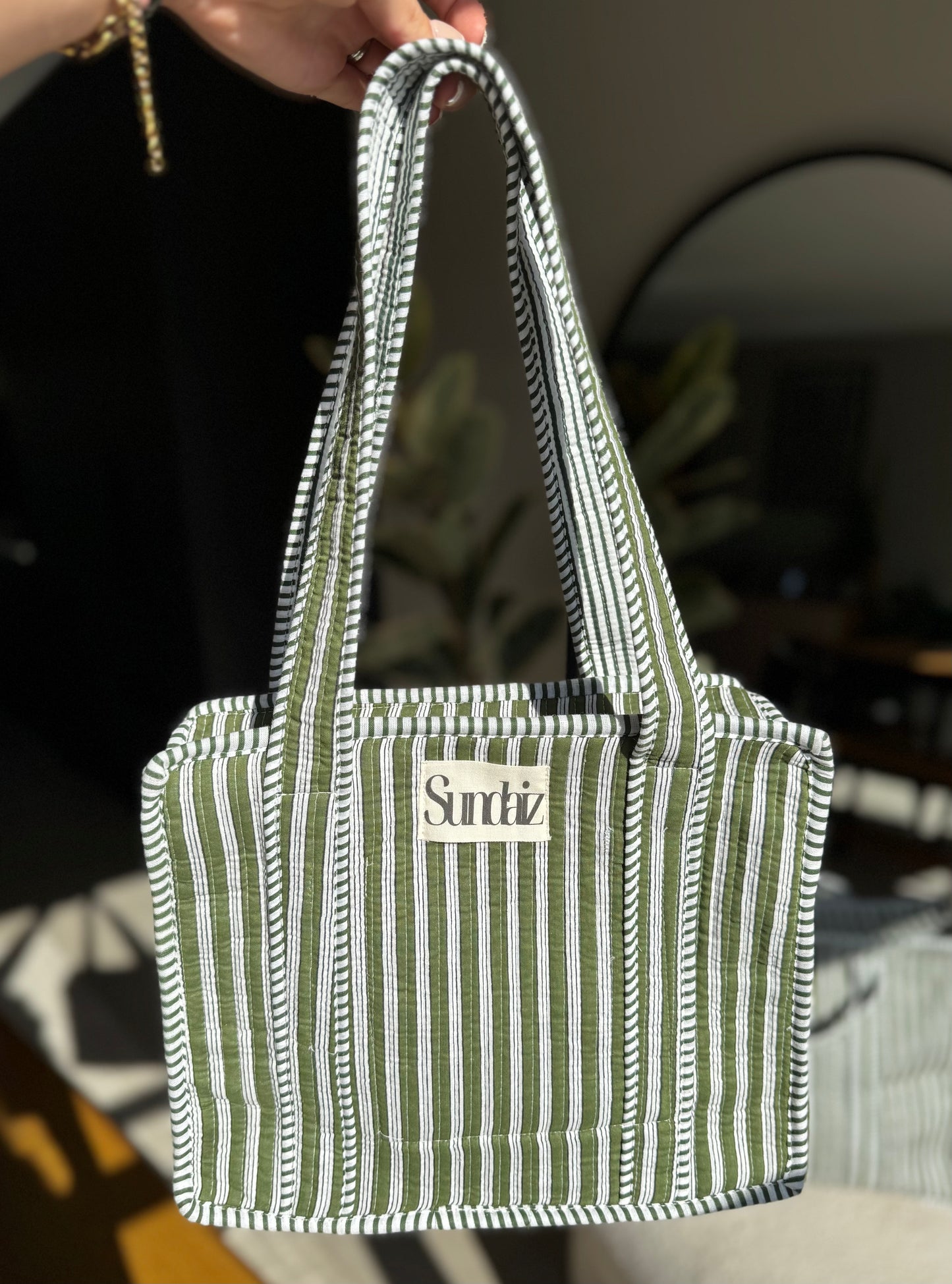 Olive stripe bags.