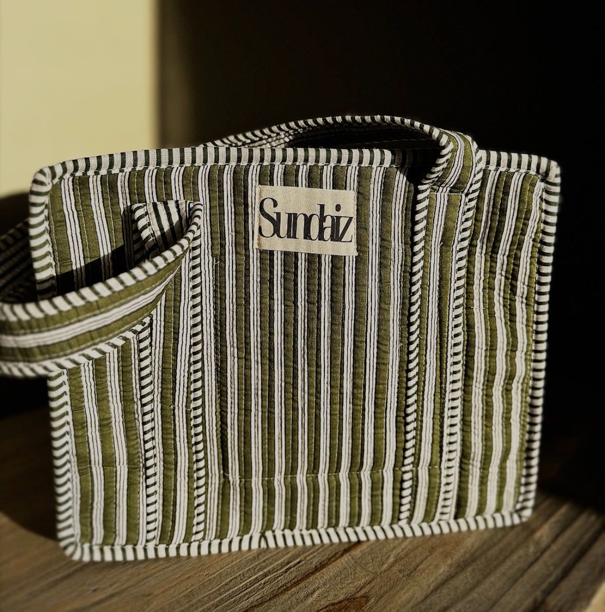 Olive stripe bags.