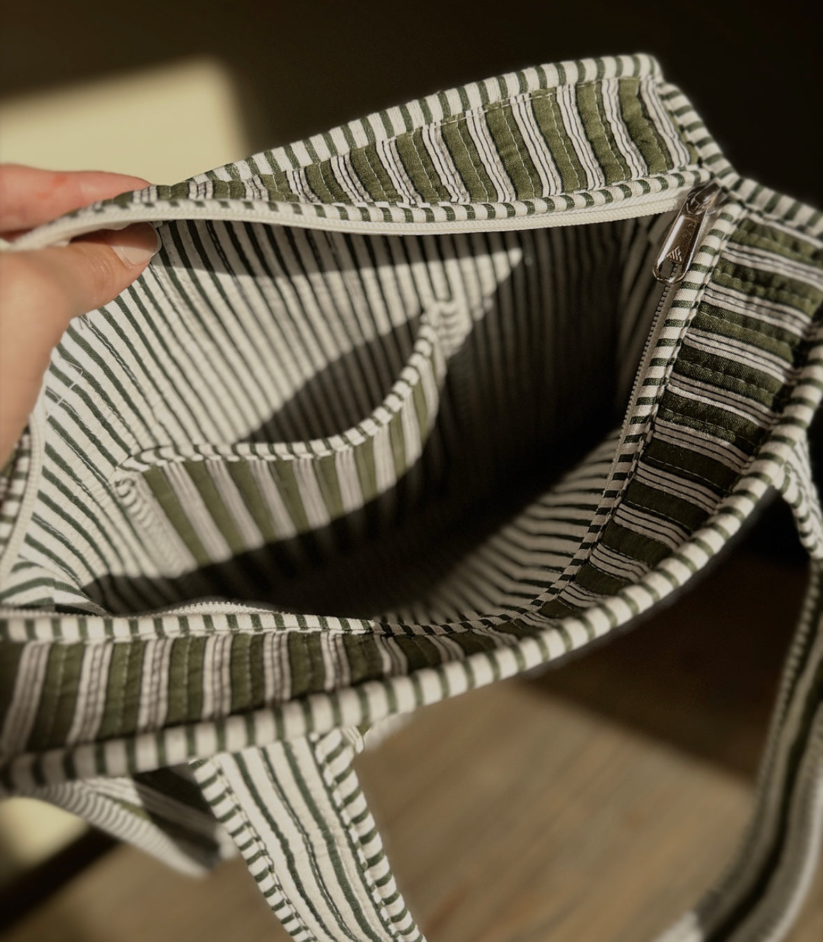 Olive stripe bags.
