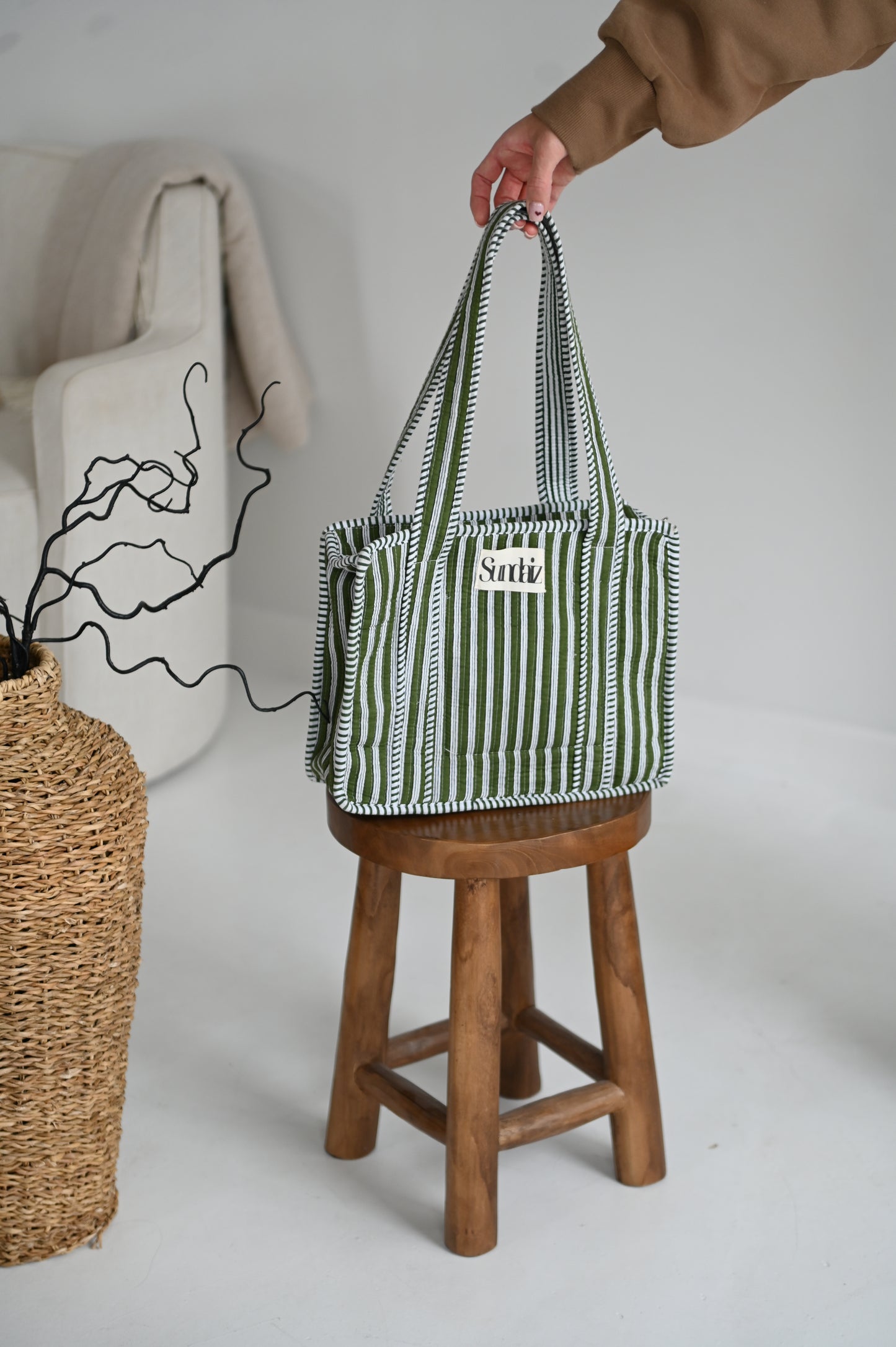 Olive stripe bags.