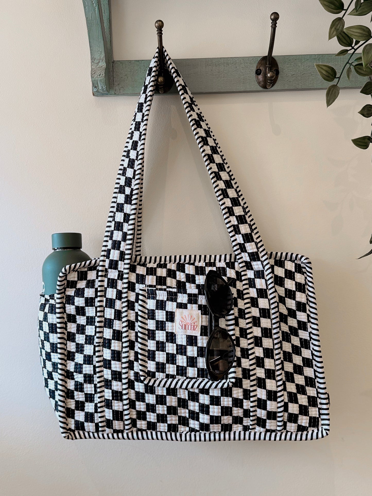 Black chequerboard midi tote.