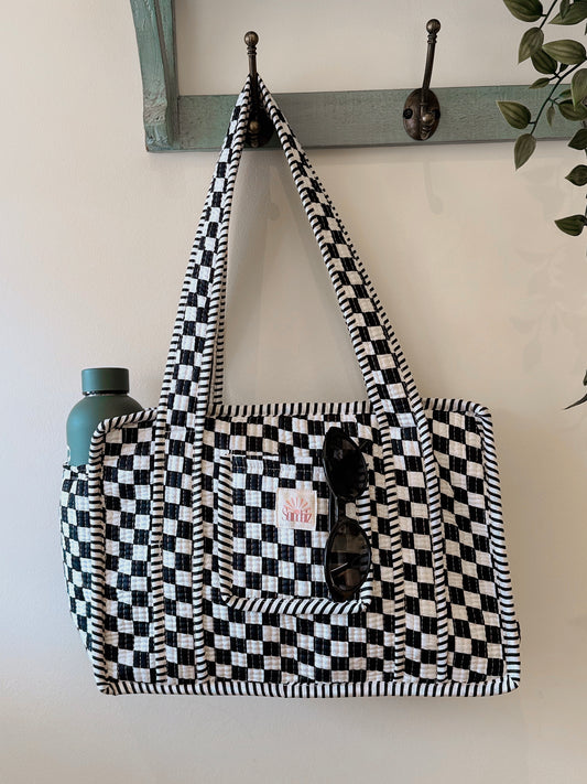 Black chequerboard midi tote.