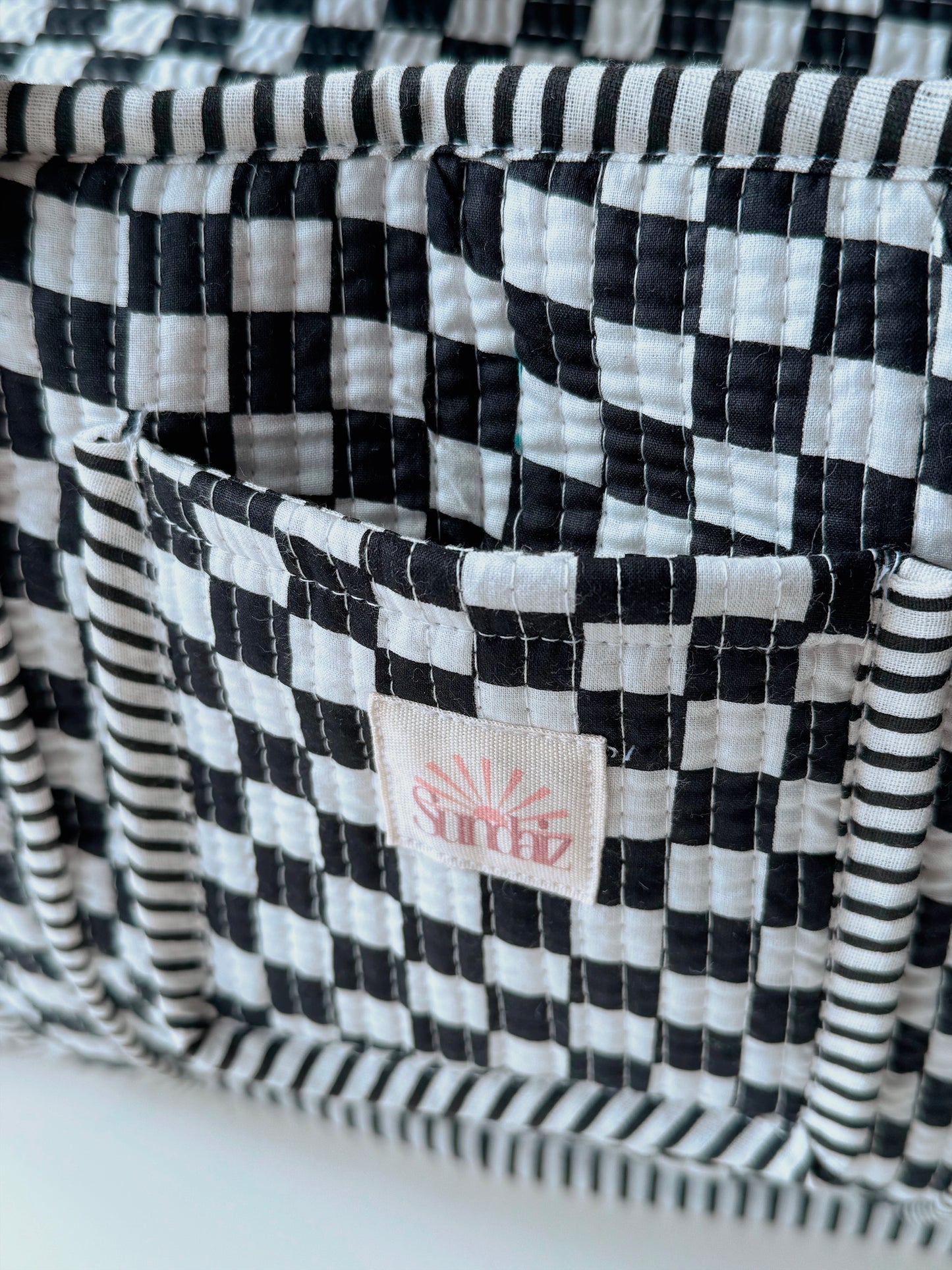 Black chequerboard midi tote.